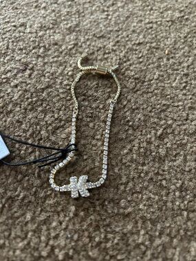 BaubleBar Gold-Tone Rhinestone “K” Slider Bracelet